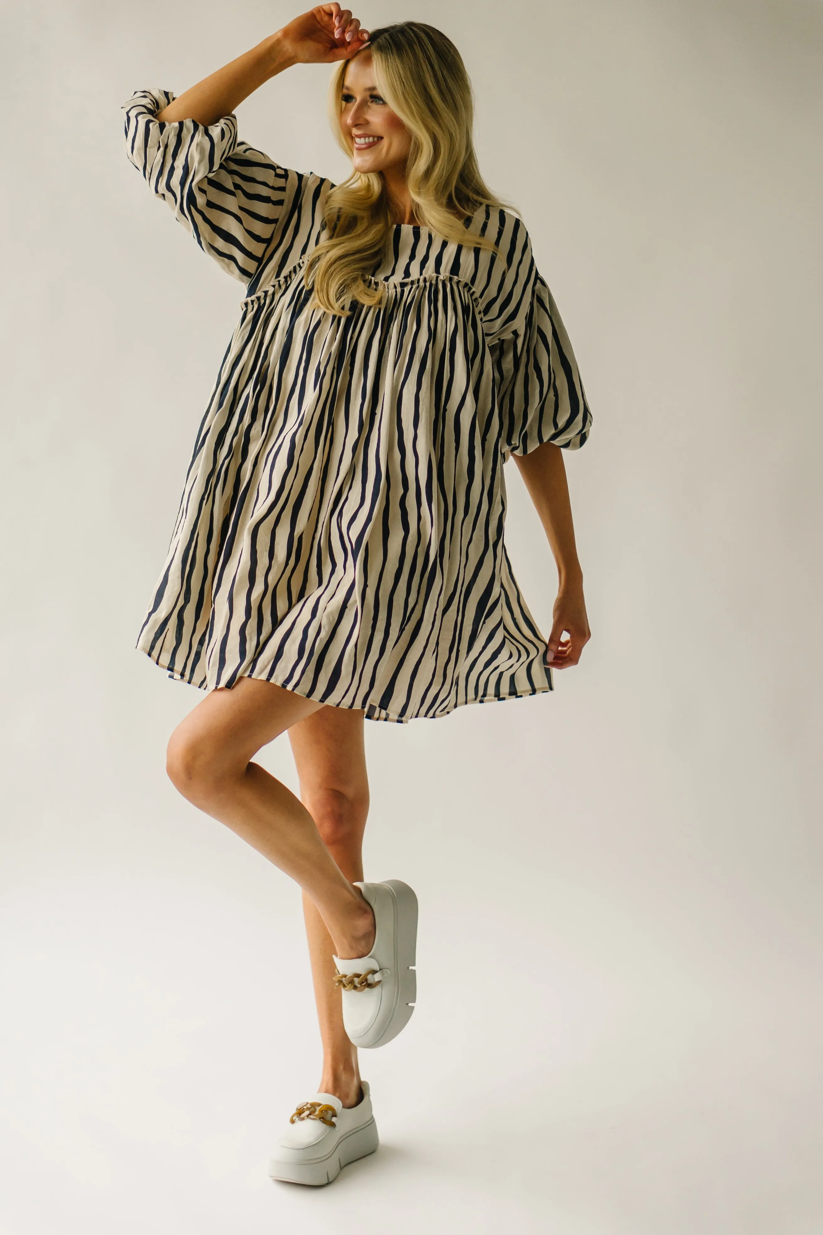 The Pampa Bubble Sleeve Babydoll Dress in Navy Stripe